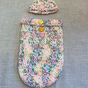 Crocheted baby hat with matching cocoon.